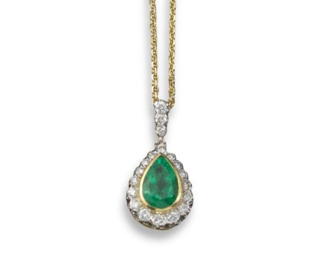 A French emerald and diamond cluster pendant, the pear-shaped emerald set within a surround of circular-shaped diamonds and y