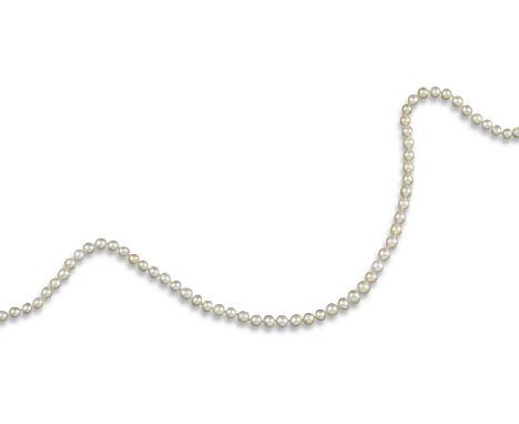 A single-row natural pearl necklace, the pearls graduate from 4.2 - 5mm, set with a lozenge-shaped white gold diamond clasp (