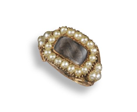 A 19th century gold mourning ring, set with a rectangular glazed centre section within seed pearl border, with a further tref