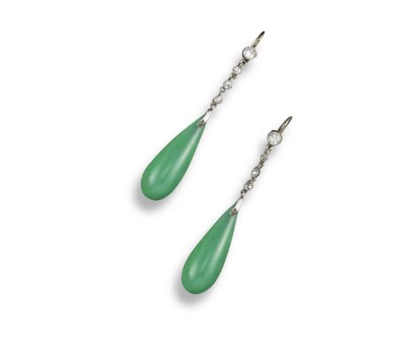 A pair of early 20th century jade and diamond drop earrings, the drop-shaped jade pendants suspend from a row of graduated ol