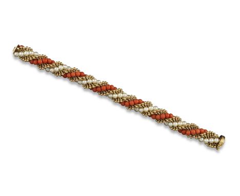 A gold, coral bead and cultured pearl bracelet by Van Cleef &amp; Arpels, c1965, in twisted form, signed with initials VCA an