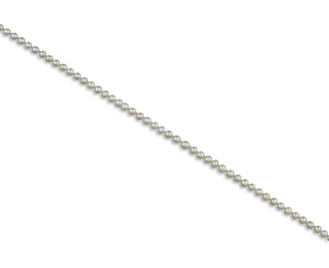 A single-row natural pearl necklace, the pearls graduate from 4.1 - 5.7mm, alternately-set with seed pearls, with a paste-set