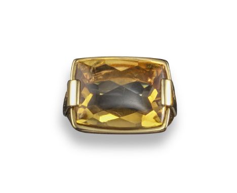 A citrine Metropolis ring by Bulgari, the rectangular-shaped citrine is horizontally-set in yellow gold, the shoulders each e