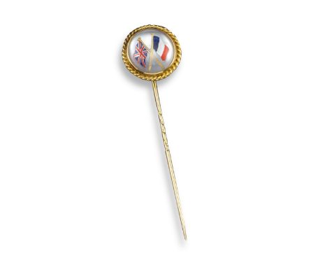 A reverse-carved crystal gold stick pin, depicting the Union Flag and French Tricolour within a gold circular ropetwist borde