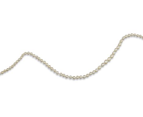 A single-row natural pearl necklace, the pearls graduate from 3.2 - 5.8mm, with a three-stone pearl and diamond clasp, 44cm l