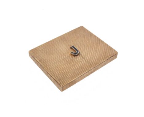 A 9ct gold box by Asprey, with engine-turned decoration and surmounted with a 'J' set with calibre-cut sapphires, interior st