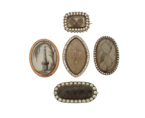 A group of five George III gold mourning brooches, including a lozenge-shaped locket brooch with blue and white enamel dated 