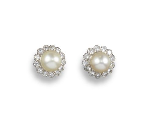 A pair of natural pearl and diamond cluster earrings, each natural pearl is set within a cluster of circular-shaped diamonds 