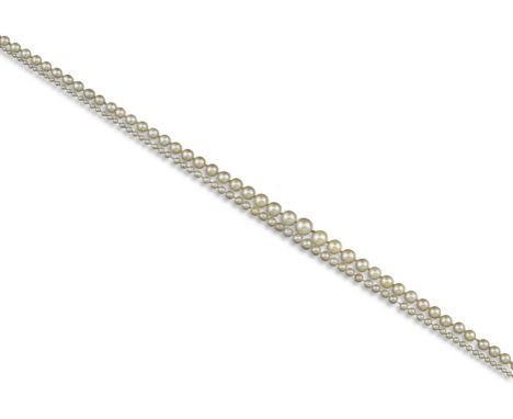 A two-row natural pearl necklace, the pearls graduate from 1.9 - 8.2mm, with an Art Deco clasp set with circular and baguette