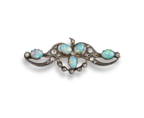A Victorian opal and diamond brooch, set with a trefoil of opal cabochons within diamond scroll borders and opal and diamond 