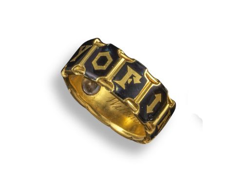 A mid 19th century gold and enamel mourning ring, decorated with black enamel panels and 'In Memory Of', the inner inscriptio