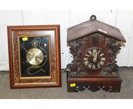 A CARVED BLACK FOREST STYLE CUCKOO MANTEL / WALL CLOCK TOGETHER WITH A MODERN WALL CLOCK IN THE FORM OF A POCKET WATCH