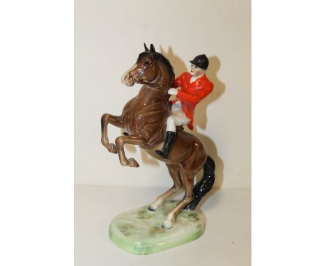 A BESWICK REARING HORSE AND RIDER NO 868  S/D