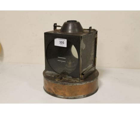 A COPPER BASED OIL BURNING LANTERN 