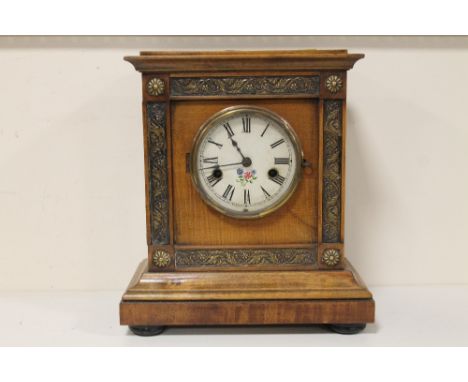 A MODERN MAHOGANY CASED MANTEL CLOCK