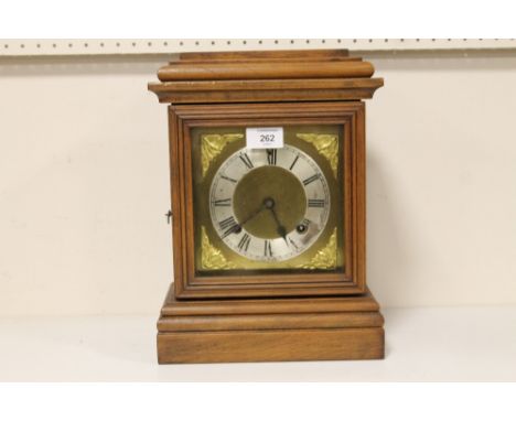A BRASS FACED MANTEL CLOCK