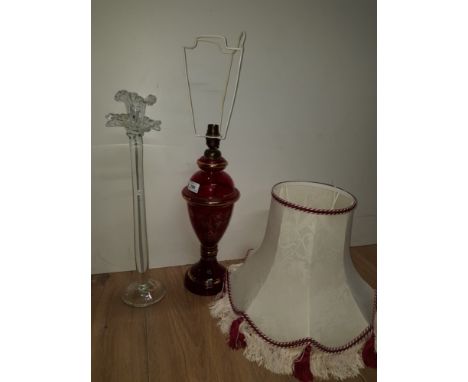 A NICE SOLID GLASS CANDLE HOLDER AND A RED GLASS LAMP