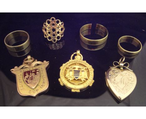 A Bristol Charity Cup Competition 9ct gold Winners Medal 1919/20, a Wiltshire Football Association 9ct gold medallion, a 9ct 