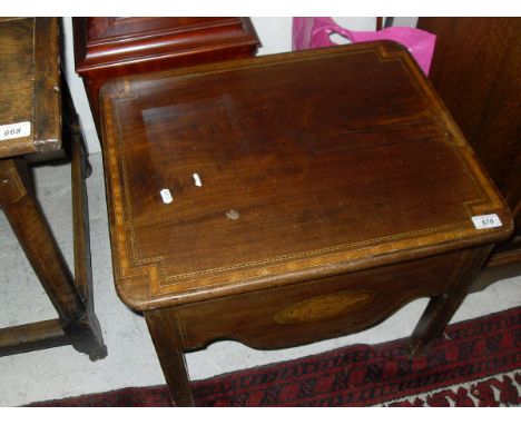 A 19th Century mahogany and inlaid commode, the rising top revealing a pottery lined interior over a shell marquetry inlaid a