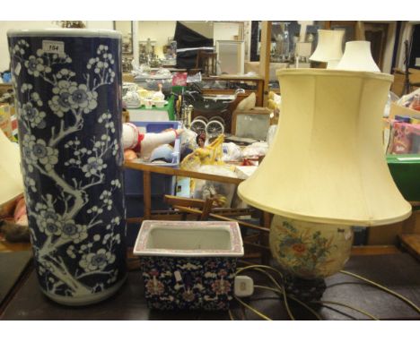 A 20th Century Chinese cylindrical stick stand decorated with prunus blossom, together with a Chinese rectangular planter dec