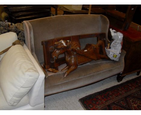 An Edwardian two seat sofa in fawn upholstery with square section tapering legs to brown china castors 