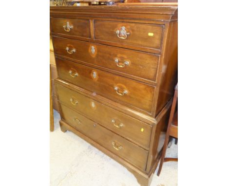A 19th Century mahogany chest on chest, the plain top above two short and two long drawers on a base of two long drawers to b