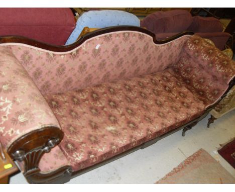 A William IV scroll arm sofa with show frame and pink velvet floral decorated upholstery, raised on turned and ringed legs to