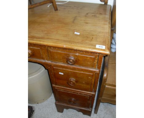 A pine topped dressing table with seven assorted drawers to bracket feet