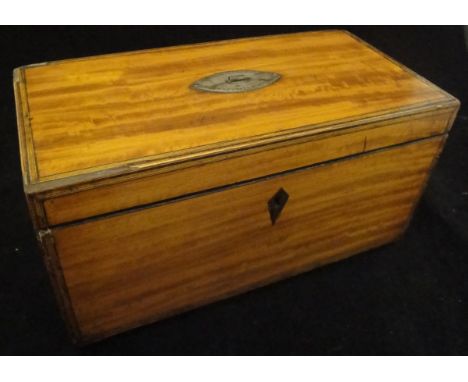 A Regency satinwood and inlaid tea caddy, the two canisters with oval lids flanking a central recess