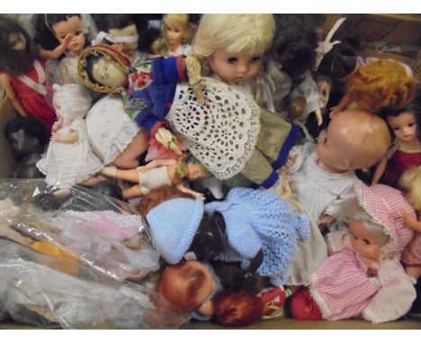 Two boxes of various 20th Century dolls, together with a collection of various Barbie, Sindy, Patch and Pippa clothing CONDIT