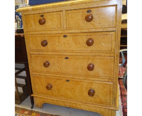 A Victorian painted pine chest of two short and three long graduated drawers, painted to simulate maple, with turned mahogany