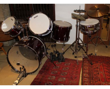 A five piece drum kit by Adder Pro and Canon with high hat, cymbals, bass, snare, etc