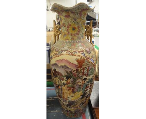 A modern Japanese vase decorated with figures in a garden setting playing music