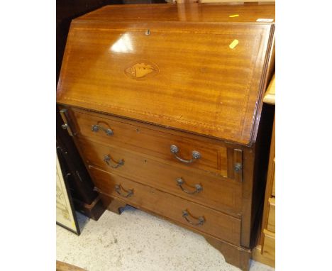 An Edwardian mahogany and inlaid bureau, the plain top above a drop front to three long drawers, raised on bracket feet