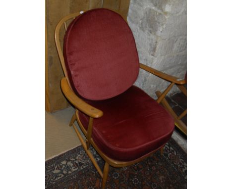 A light elm Ercol easy chair, stick back stool and stick back rocker chair CONDITION REPORTS NB. No cushions on any items due