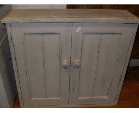 A pine wall hanging two shelf unit together with a cream painted two door wall hanging cupboard and a cream painted cylindric