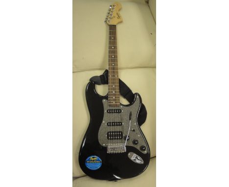 A Fender Squire "Strat" copy electric guitar (SN. CY08071604) together with a Line 6 Spider III 15 speaker, guitar standard K