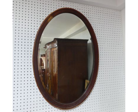 An Antique Large oval wall Mirror, H 95.5 cm x W 65 cm. 