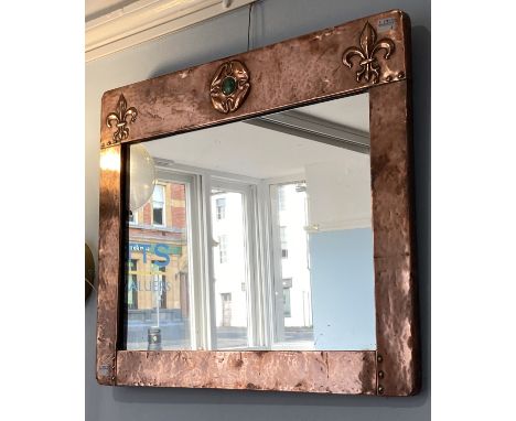 An Arts and Crafts square copper Mirror, with ruskin style plaque, H 46 cm x W 56 cm. 