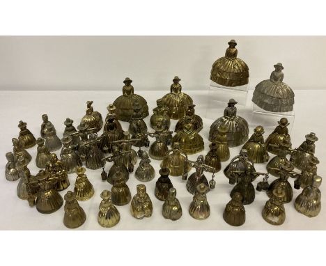 A collection of assorted metal ware vintage bells, to include brass.  All in the shape of milk maids and crinoline ladies. 