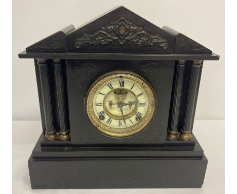 A Victorian black slate mantle clock from the Ansonia Clock Co.  With column detail, brass &amp; ceramic face and bevel edged
