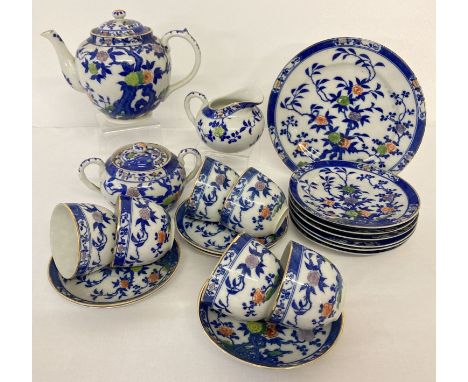 An early 20th century Japanese ceramic 6 setting tea set.  Comprising: Teapot, lidded 2 handled sugar bowl, milk jug, Sandwic