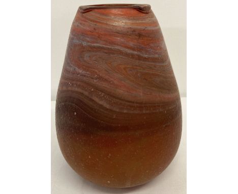 A hand blown orange art glass vase with marble effect detail.   Approx. 20 cm tall.