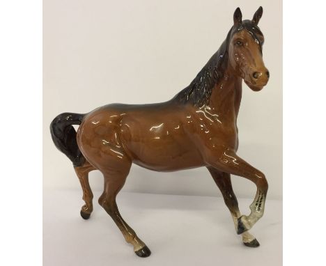 Beswick "Spirit of the Wind" ceramic horse figurine in chestnut brown gloss finish.  Model #2688, made from 1982-89, designed