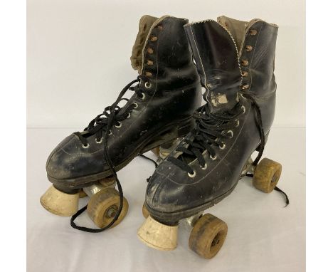 A pair of vintage leather roller skates.   Adult size 8.