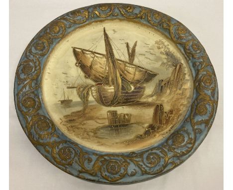 A large vintage ceramic wall plaque. Central boat design with gilt detailing.  Surrounded by a blue and gold border.  Approx.