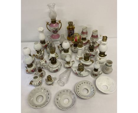 A quantity of vintage ceramic miniature oil lamp figurines.  