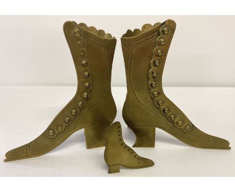 2 vintage brass vases in the shape of ladies Victorian button up boots.  Together with a small flat brass shoe with stand. 