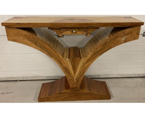 An Art Deco style V shaped console table with marquetry detail to top and central drawer.  Small water mark to front.  Approx