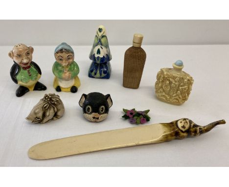 A tray of mixed ceramic and resin items. To include a highly decorated snuff bottle with spoon.  Lot also includes a wicker c